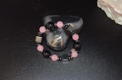 Kube og rosa kuler arm