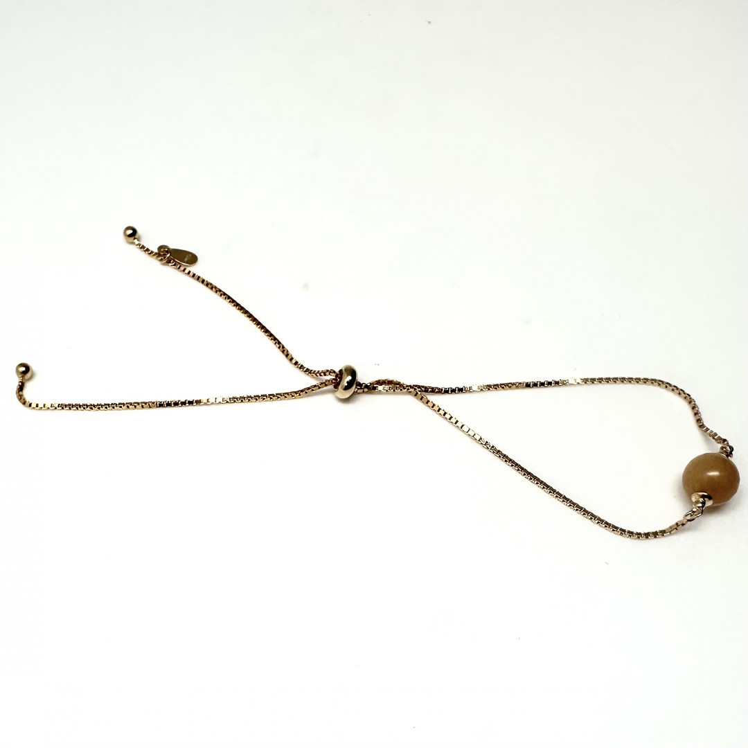 Gullbelagt armbånd med Rav kule